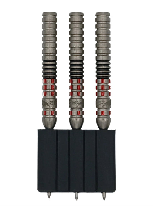 Three darts with metallic shafts and red accents in a black holder on a white background